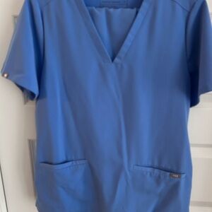 Blue Women's scrub top and jogger style pants. Medium. Light blue.